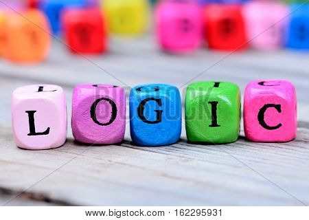 Logic word on grey wooden table closeup