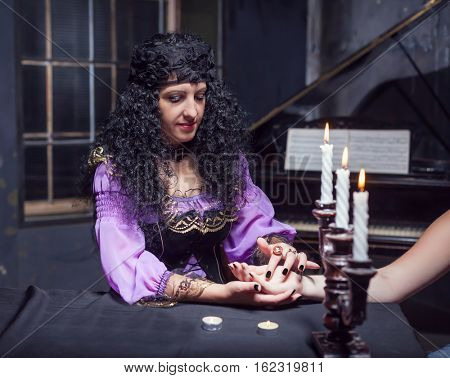 Sorceress reading somebody's hand