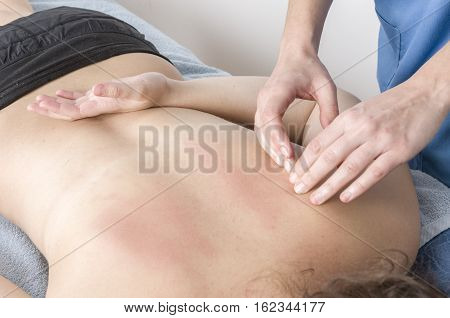 Physiotherapist, Chiropractor Giving A Massage And Stretching Of Subscapularis And Rhomboid