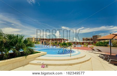Cayo Coco island, Pullman hotel, Cuba, June 28, 2016, gorgeous amazing view of Pullman hotel, inviting cozy stylish swimming pool and grounds on sunny beautiful summer day