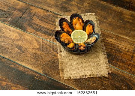 Delicius appetizer with natural mussels and lemon