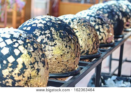 Buddha Round Stones Embedded Is Gildded By Golden Leaf .
