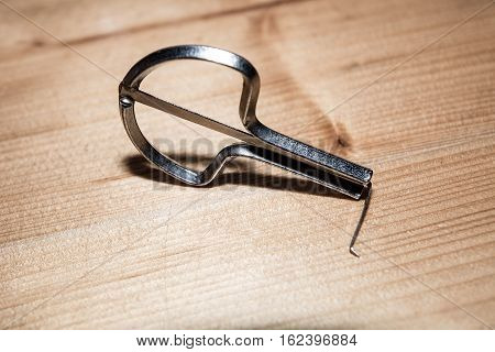Jew`s harp - traditional folk instrument on the wood