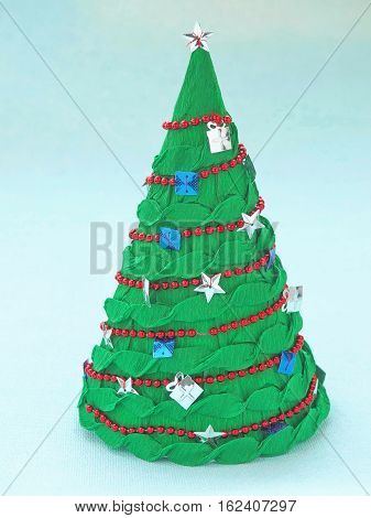 Handmade paper Christmas tree. Holiday handicraft and decoration.