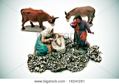figures representing nativity scene on white background