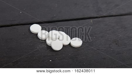 Traditional Dutch white candy Pepermunt on wooden background