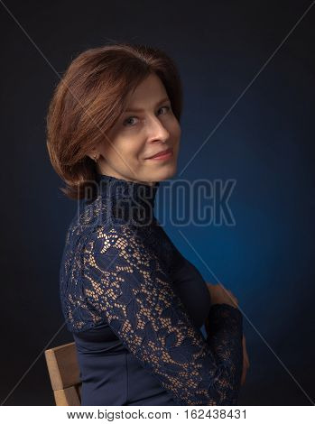 Portrait Of A Middle Age Woman In Blue Dress