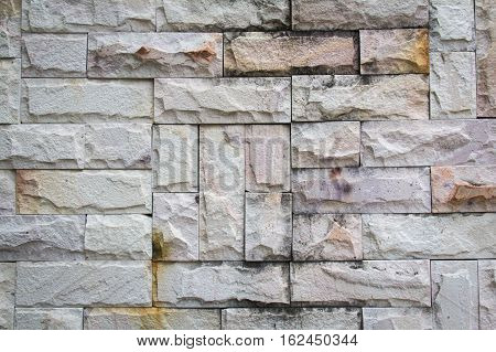 Abstract weathered seamless texture stained old stucco light gray and aged paint white brick wall background in rural room grungy rusty blocks of stonework technology. High resolution white brick