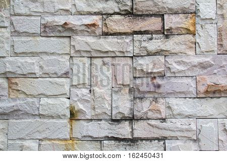 Abstract weathered seamless texture stained old stucco light gray and aged paint white brick wall background in rural room grungy rusty blocks of stonework technology. High resolution white brick
