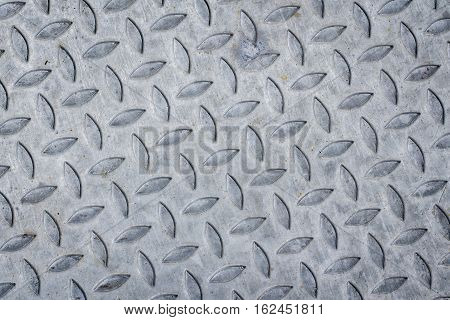 pattern style of steel floor for background . Seamless steel diamond plate texture