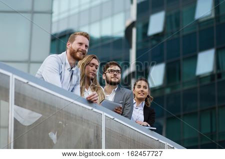 Young business colleagues outdoor in a city