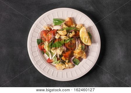 Italian Appetizer salad with tomatoes, bread, bazil mixed with lemon juice