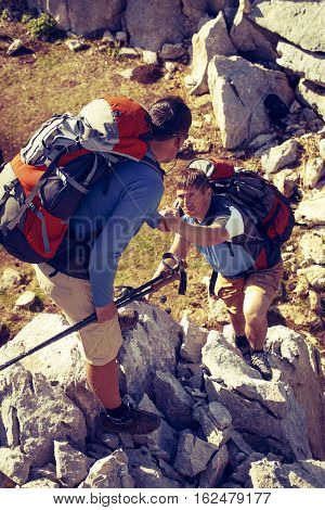 Help support and help in a dangerous situation to hike in the mountains.