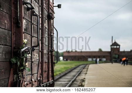 flower attached to Historic Train on rails at concentration camp Auschwitz Birkenau KZ Poland