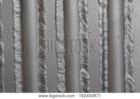 Metal panel made of rounded steel pipes. Ideal metallurgical weld.