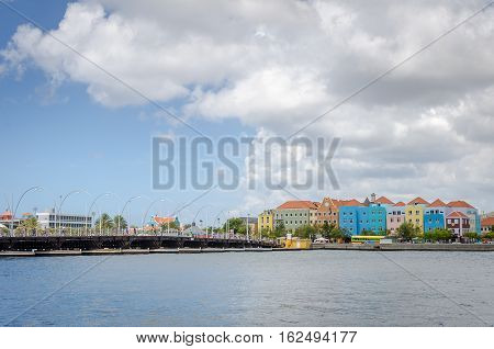Willemstad, Curacao Handelskade With Colorful Facades And Queen Emma Bridge