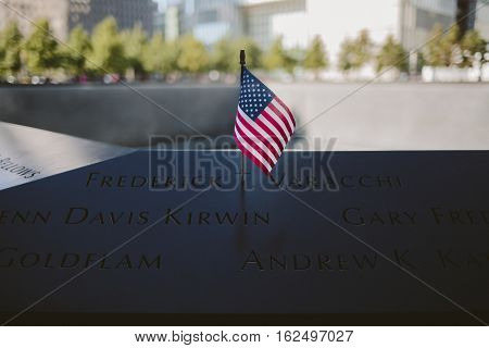 American flag at the memorial to victims of Sept. 11 2001. Memorial at World Trade Center Ground Zero.