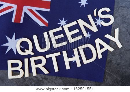 Queen's Birthday signage on the Australian flag.