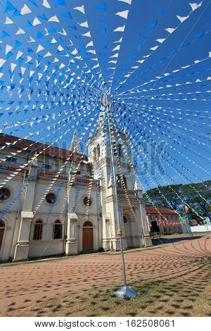 Santa Cruz Basilica in Cochin decorated for Christmas flags India