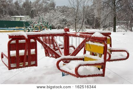 children's carousel in the ice on a children's snow playground