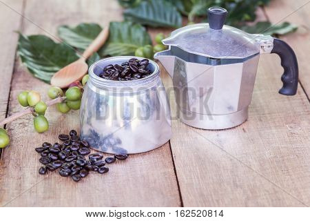 Fresh Coffee Beans On Wood With A  Moga Pot