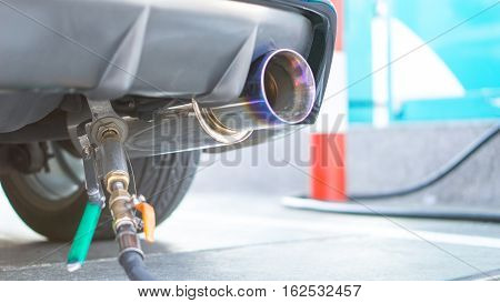 Fuel gas station and car fuel empty concept - Rear view of car refuel LPG CNG gas in gasoline station for car and copy space