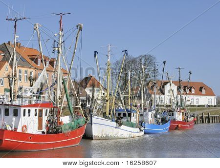 Colored fishing boats in historic harbor
