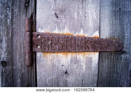 wooden door with old door rusty lock