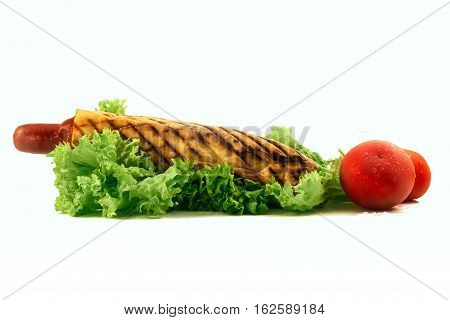 French hotdog isolated wil leaf of salad and two tamotas wit drop of water