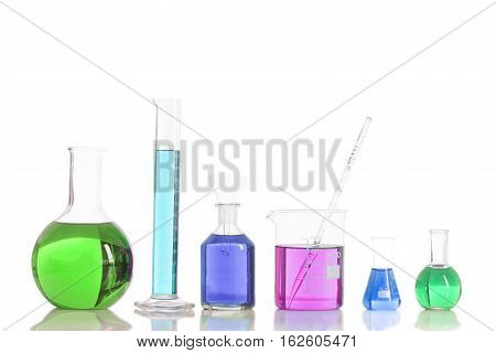 Various laboratory flasks with a colored reagents,