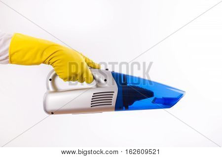 Maid Holding Vacuum Cleaner On White