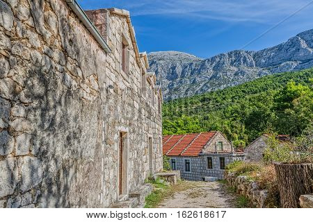Typical house in Tucepi old village in the slope of a mountain Biokovo.