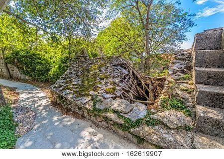 Ruins of typical house in Tucepi old village in the slope of a mountain Biokovo.