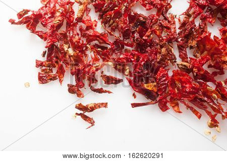 Red hot Trinidad moruga scorpion peppers chopped on white background