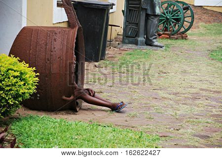 Little girl playing hide and seek in a jar. Africa
