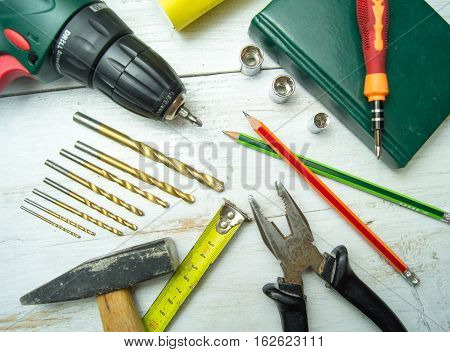 Old tools for work on a wooden table