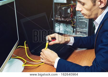 Man In Suit Holding Network Cables Concept Is The Connection