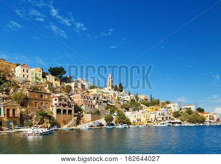 Greece. Dodecanesse. Island Symi Simi . Colorful houses on the rocks