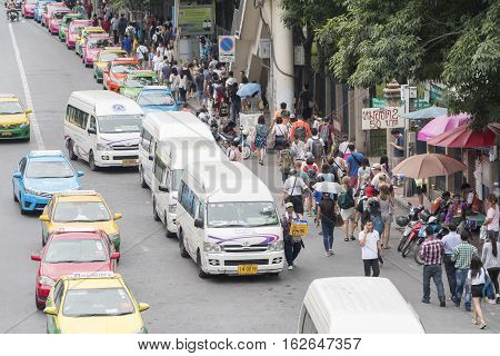Bangkok Thailand - November 07 2015: van taxis taxis and people crowd on street at jatuchak market. Jatujak is the largest market in Thailand and the world's largest weekend market.
