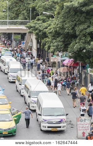 Bangkok Thailand - November 07 2015: van taxis taxis and people crowd on street at jatuchak market. Jatujak is the largest market in Thailand and the world's largest weekend market.