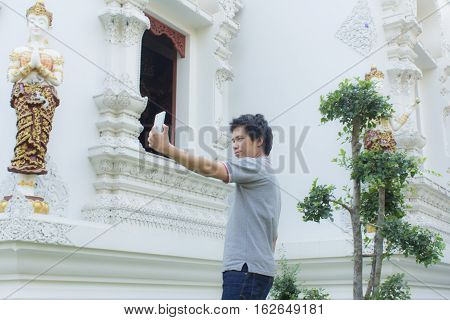 thai man Selfie at thai temple asian