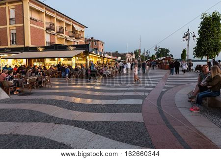 LAZISE ITALY - MAY 5 2016: Shops bars and restaurants in Lazise at Garda Lake. Italy