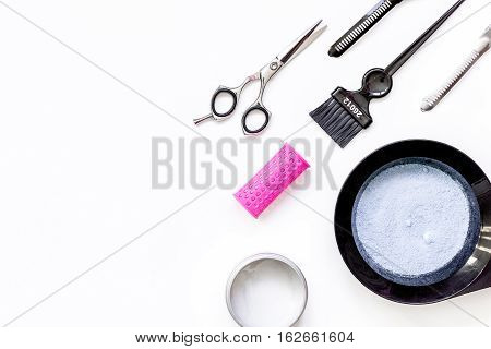 Tools for hair dye and hairdye top view on white background