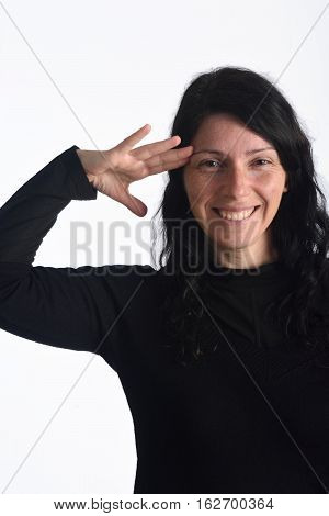 Woman making a military greet isolated on a white color