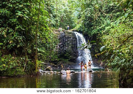 Pedro Vicente Ecuador - August 28 2015: Group of unidentified young people taking a bath in the waterfall El Encuentro in Pedro Vicente.