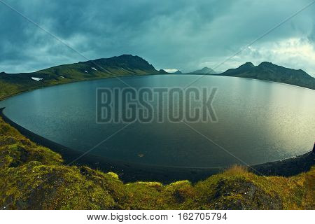 Lake coast with mountain reflection at the sunrise, Iceland. treking in Iceland. Travel concept.