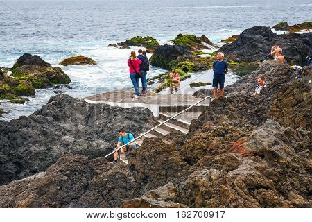 Garachico, Tenerife Island, Spain, 08 June 2015: Natural Volcanic Pools Visited By Tourists In Garac
