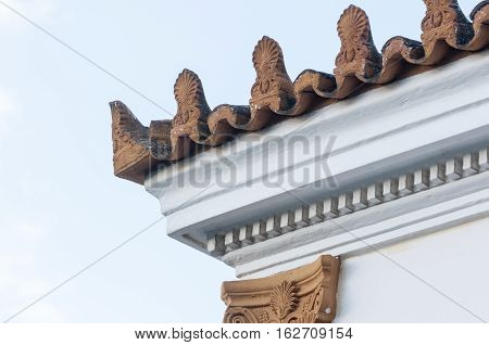 stoneware roof decoration in old building, sky