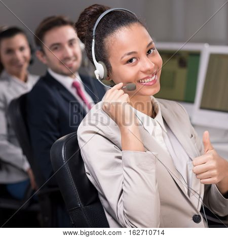 Smiling Consultant With Thumb Up