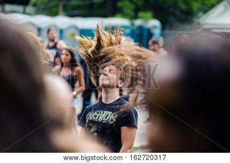 TOLMIN, SLOVENIA - JULY 25TH: HEAVY METAL FANS HEADBANGING AT THE METALDAYS FESTIVAL ON JULY 24TH, 2016 IN TOLMIN, SLOVENIA